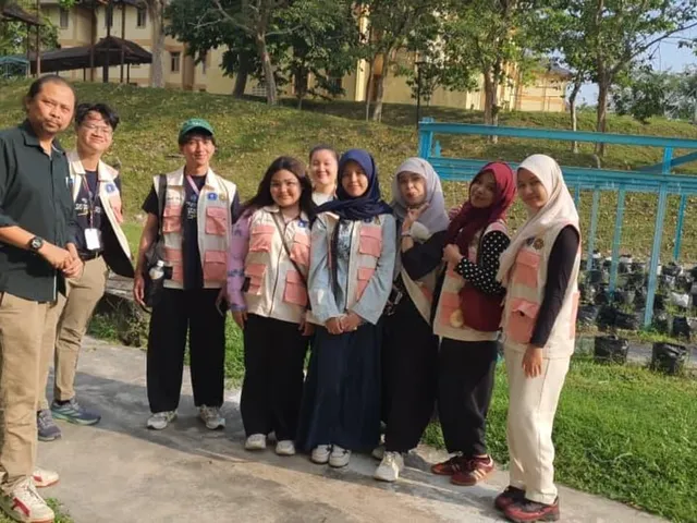 A group of community volunteers and student caretakers gathered at the fertigation frame