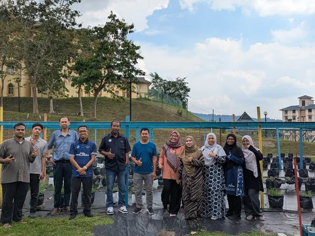 University advisors and student caretakers gathered among the grow bag nursery rows